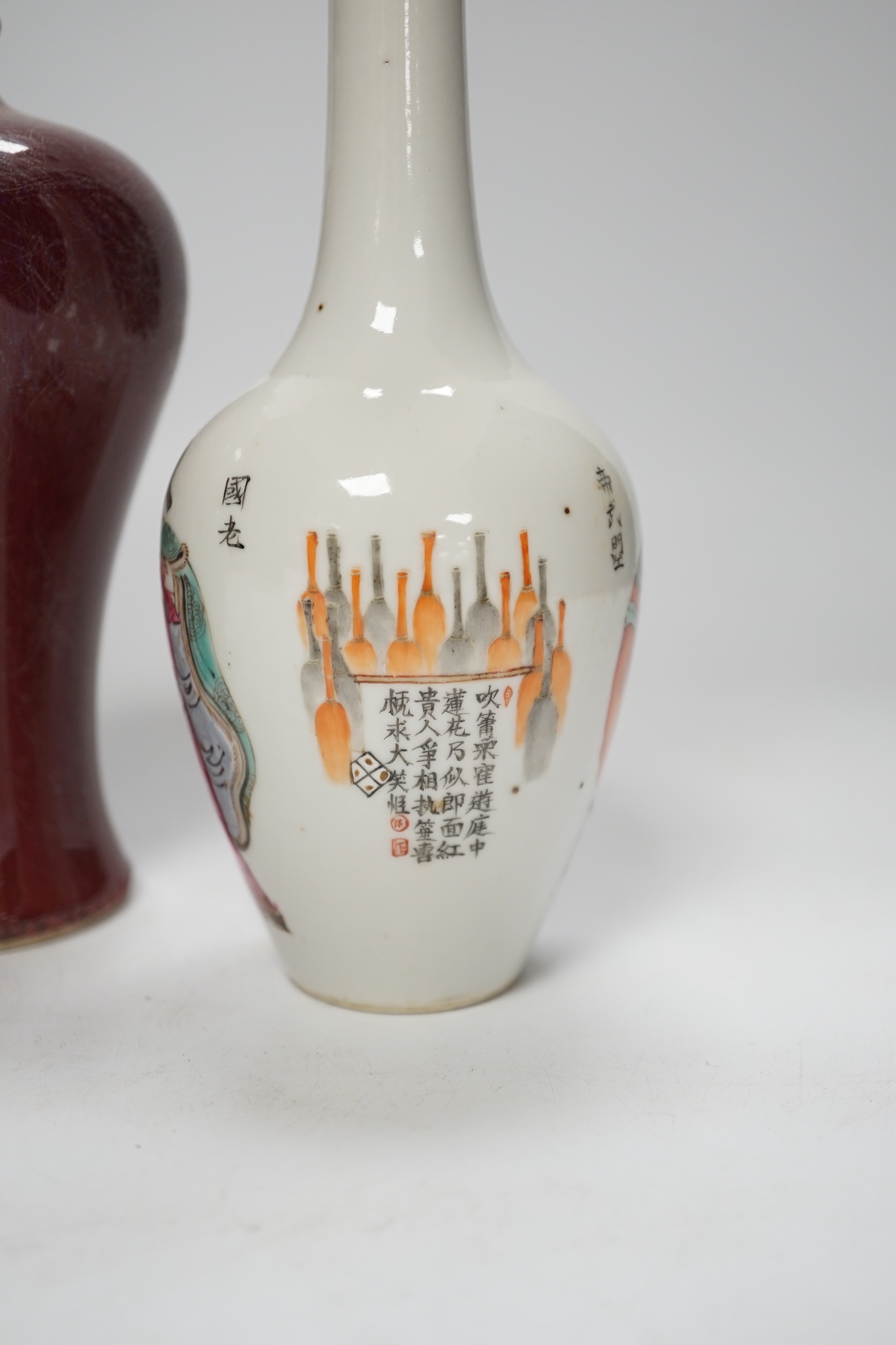 A Chinese double gourd vase, a sang de boeuf vase and a famille rose vase, 18cm high